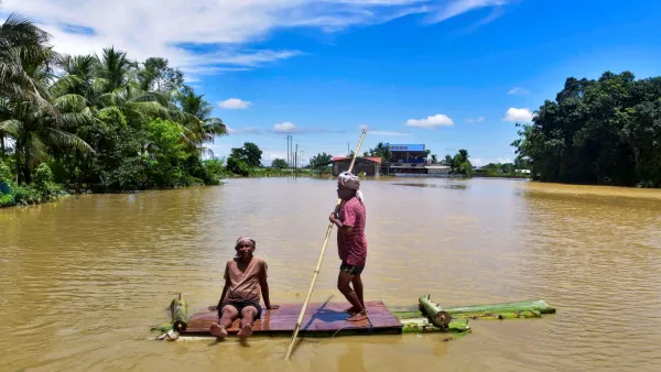 Residents moving on a bamboo raft in Sivasagar